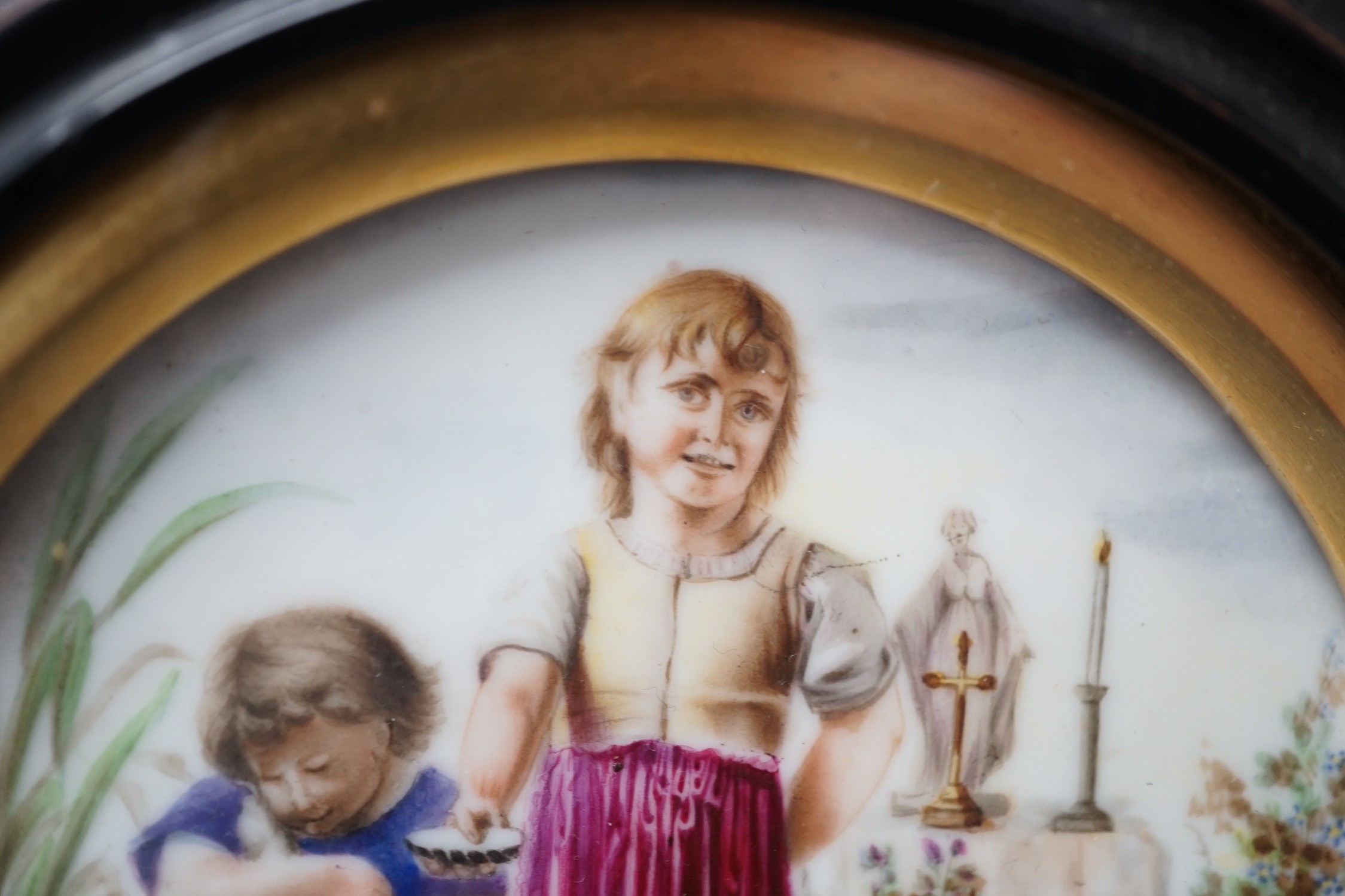A 19th century Continental porcelain plaque. 16cm diameter overall